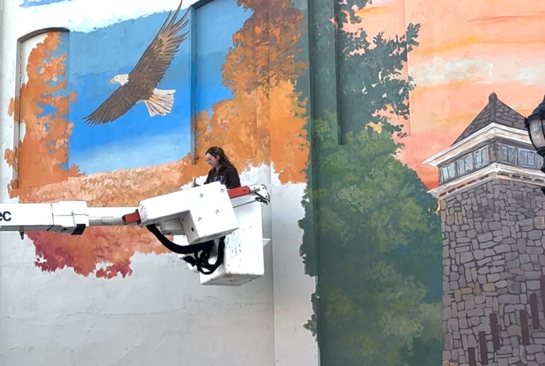 Cheyenne Renee Paints Her 37th Mural in Downtown Cornelia, Georgia